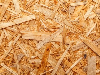 Panoramic Close-Up of Large OSB Chipboard Texture Showcasing Compressed Wood Pieces in Stunning Detail for Interior Design and Construction Applications