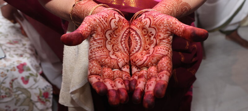 woman in mehendi hands an indian tatoo