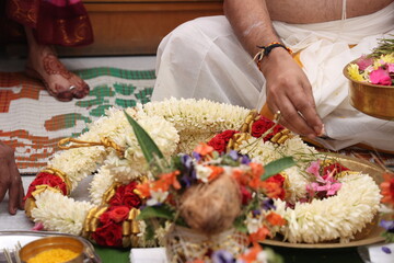 hands of a person performing Ganapathi pooja