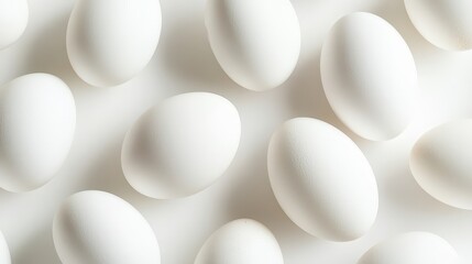 On a pristine white background, a group of chicken eggs rests, their smooth shells reflecting light softly.