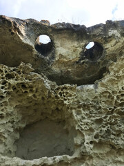 Natural rock in the form of a flying demon. Smiling bat. Bakla, Crimea.