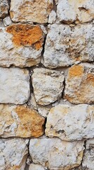 Obraz premium Weathered Stone Wall Texture: Rustic & Natural Background