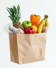 Fresh fruits and vegetables in paper bag, including pineapple, bananas, bell peppers, and apples, showcasing healthy eating and vibrant colors