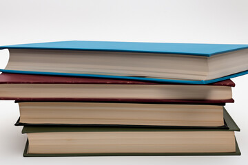A stack books on a white . book education school concept. close up of stack of books on white . close up of stack of books on lifestyle white.