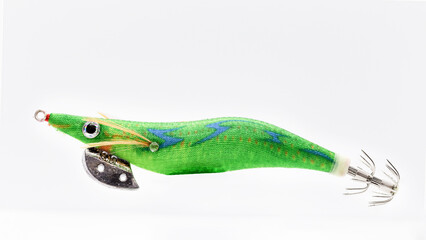 An Egi ,in this picture predominantly green color, its a fake lure for squid and cuttlefish a fishing lure for casting and spinning.