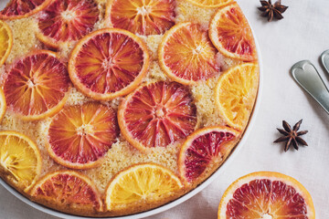 Delisious freshly baked homemade blood orange upside-down cake, close up. Popular winter holiday dessert.