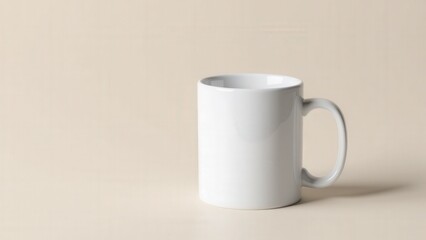 Obraz premium A minimalist branding mug mockup displaying a ceramic mug with a blank surface on a neutral background.
