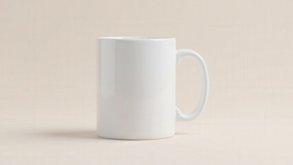 Obraz premium A clean tea mug mockup displaying a ceramic mug with a blank surface on a neutral background.