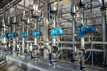 Heating and water supply system for greenhouses. Steel pipe framework with thermostats regulating...
