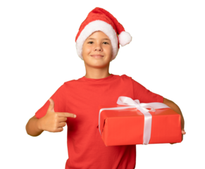 Smiling beautiful child in Santa red hat holding Christmas gift in hand isolated over transparent background. Christmas concept.