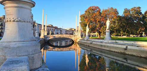 Prato della Valle with statues Prato della Valle with statues with reflection in the water in...