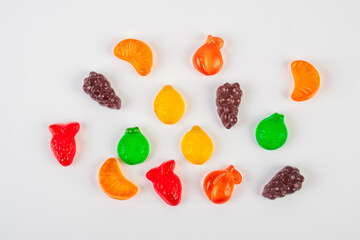 Assorted gummy candies, Juicy colorful jelly sweets. Gummy candies on white background