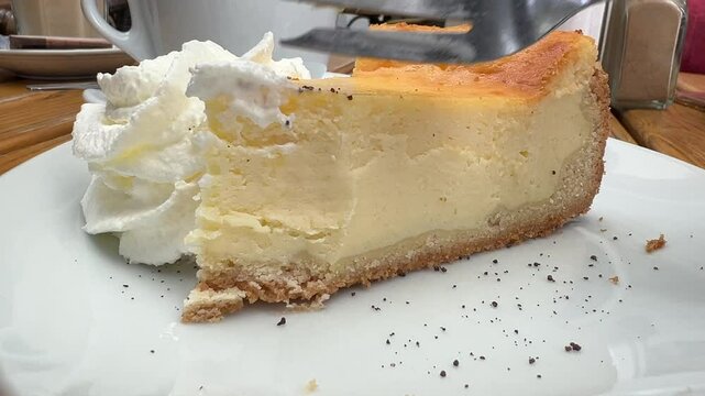 Eating a cheesecake close up