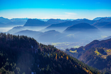Mountains and valleys in the misty haze of the foothills of the Alps