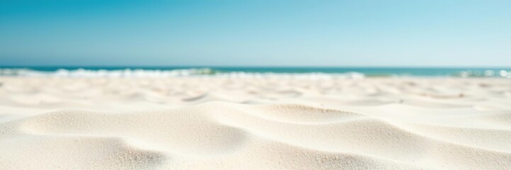 Obraz premium Soft fine sand on a summer beach with a clear blue sky, cloudless, sun, natural