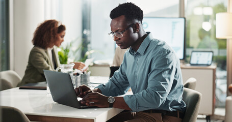 Meeting, typing and man in office with laptop for research, data analysis or business report at startup. Computer, web idea and businessman in boardroom planning online schedule at digital agency