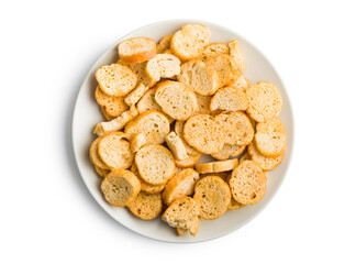 Sliced roasted bruschetta bread on plate isolated on white background.
