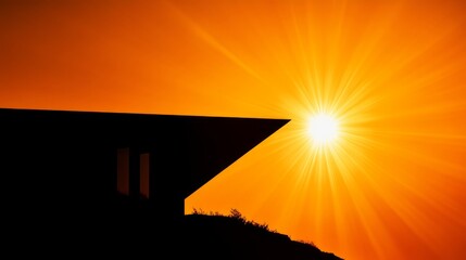 Sunset silhouette of a modern building.