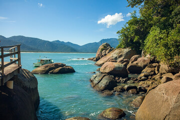 Obraz premium View of Aventureiro beach with turquoise waters and rocks on Ilha Grande, in the south of Rio de Janeiro state, Brazil