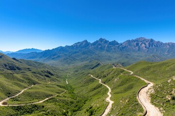 Naklejka premium Winding mountain road adventure majestic highland landscape scenic viewpoint nature photography travel inspiration