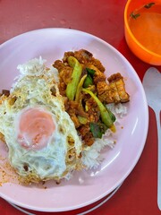 Rice topped with stir-fried pork and basil, Rice topped with stir fried minced pork and basil with Fried egg