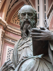 The bronze statue of St. John the Evangelist from the year 1515 by Baccio da Montelupo in the external niches of the church of Orsanmichele in Florence, Italy.