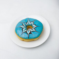 Blue glazed donut with intricate chocolate swirl design. A visually stunning dessert ideal for festive, creative, or food-related content.