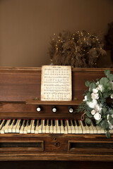 Vintage piano decorated for Christmas