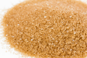 White and brown sugar on a. Sweet food ingredient concept. Close up of a handful of brown sugar on white. Close up of a handful of brown sugar and white sugar lifestyle cookies on the.