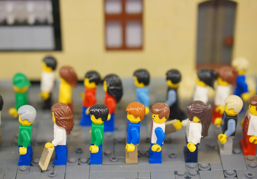 Lego figurines standing in a row