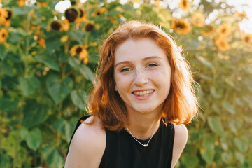 Smiling redhead girl with freckles