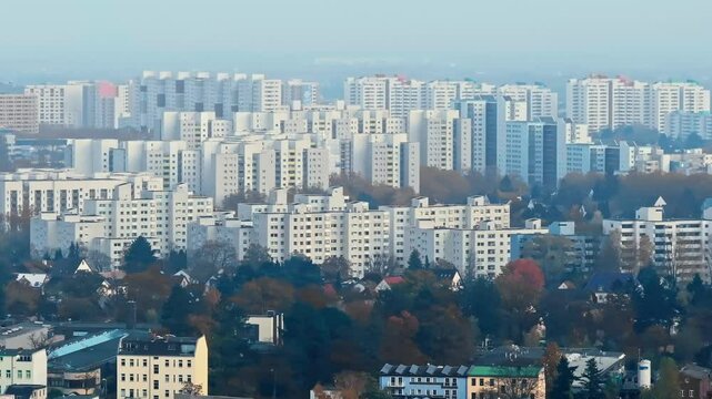 Drone video of the towering prefab apartment blocks in Berlin Reinickendorf, showcasing the height and density of urban architecture in this residential district. Drone move right
