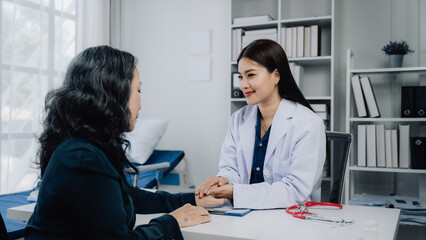 Doctor and Patient Consultation: Compassionate care, a female doctor offers reassuring support to her patient during a consultation.  The image conveys trust, empathy.