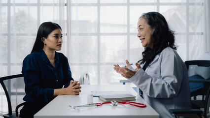 Doctor Consultation: A compassionate doctor listens intently to a patient's concerns, demonstrating...