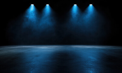 A dark room with four blue lights shining on the floor