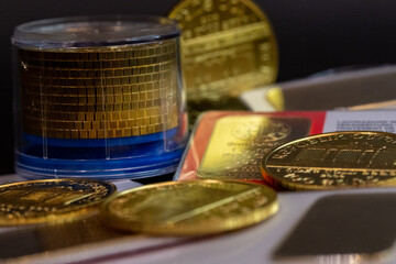 Photography close up of real golden coins on a black table and black background, photo of business, investors and market of gold growing up. with the collection of philharmonic of Austria.