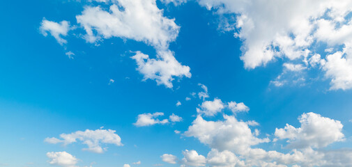 White soft clouds in the blue sky