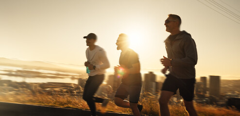 Fototapeta premium Men, fitness and running with sunset for workout, exercise or outdoor training together on mountain. Active, male people or runners with sunshine for sprint, race or health and wellness in nature