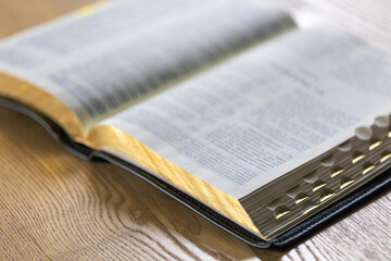 Fototapeta premium Bible close-up. Open holy book Bible. Christianity, faith and religion concept.