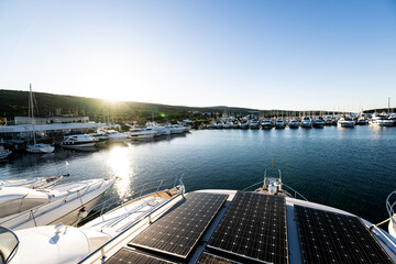 photography to solar panels collecting energy in the roof of a sustainable luxury yacht or boat...
