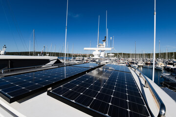 photography to solar panels collecting energy in the roof of a sustainable luxury yacht or boat...