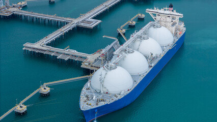 LNG (Liquified Natural Gas) tanker anchored in Gas terminal gas tanks for storage. Oil Crude Gas...