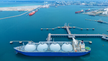 LNG (Liquified Natural Gas) tanker anchored in Gas terminal gas tanks for storage. Oil Crude Gas...