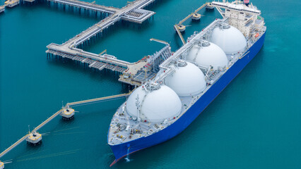 LNG (Liquified Natural Gas) tanker anchored in Gas terminal gas tanks for storage. Oil Crude Gas...