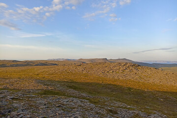 The scenery of the wild and rocky nature of Mageroya Island, Finnmark, Norway, with a view of Nordkapp in the background