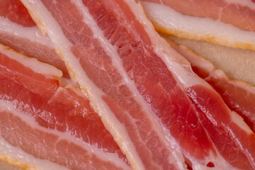 fresh thinly sliced pork bacon with meat and bacon