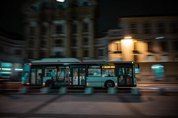 autobus at night in city center with panning effect. motion effect, public transport with bus at evening © JairoMZ