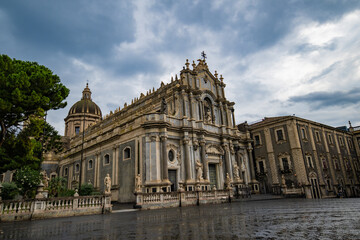 The exterior of Catania Cathedral on a rainy, cloudy day without people in Sicily, Italy. Stock photo