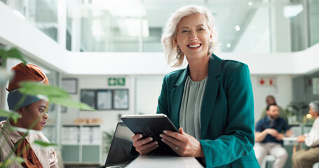 Tablet, portrait and happy business woman, ceo and manager coworking with receptionist in startup. Face, smile or mature entrepreneur, professional or expert creative director with digital technology