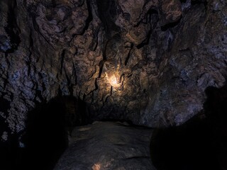 Gypsum cave with deep tunnels. Old abandoned galleries underground. Different rocks, geological and speleological research.